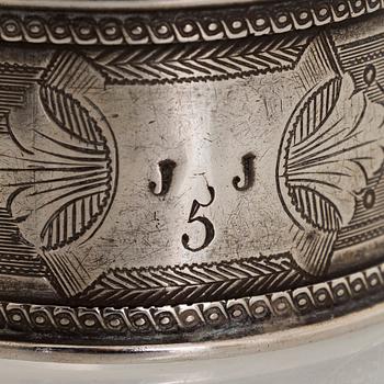 Napkin rings, 6 pcs, a pair of salt shakers, and salt cellars, silver and glass, including English and Finnish marks.