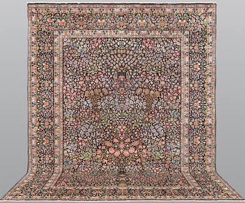 A Kirman Laver carpet, 'Millefleur', approx. 388 x 300 cm.