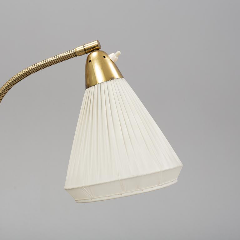 An elm floor light, mid 20th Century.