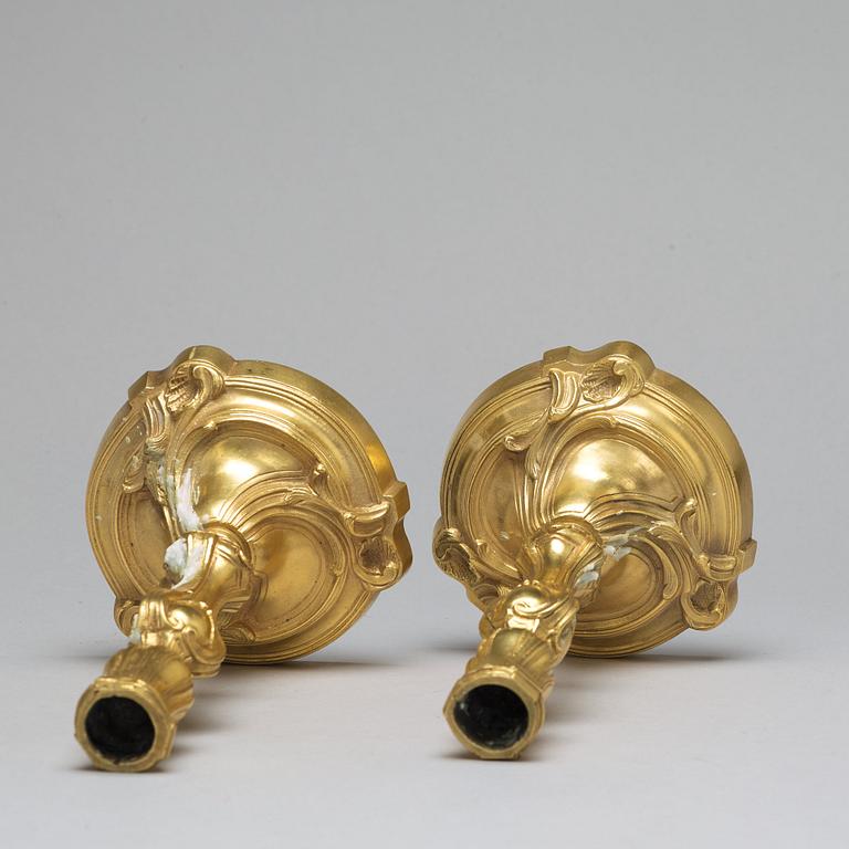 A pair of Louis XV-style candlesticks, circa 1900.