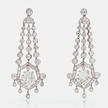 A pair of single-, brilliant-, and old-cut diamond earrings. Total carat weight circa 8.00 cts.