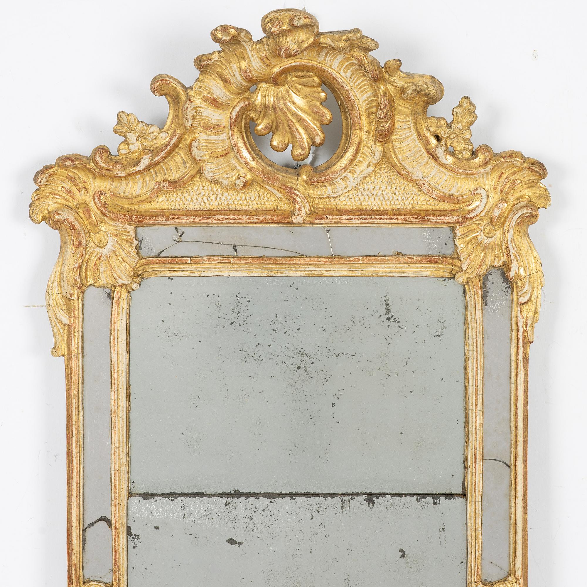 A giltwood rococo mirror, Stockholm, later part 18th century.