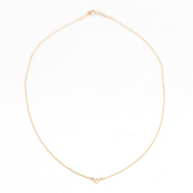 Tiffany & Co, Elsa Peretti, an 18K gold necklace with a ca. 0.05 ct diamond.