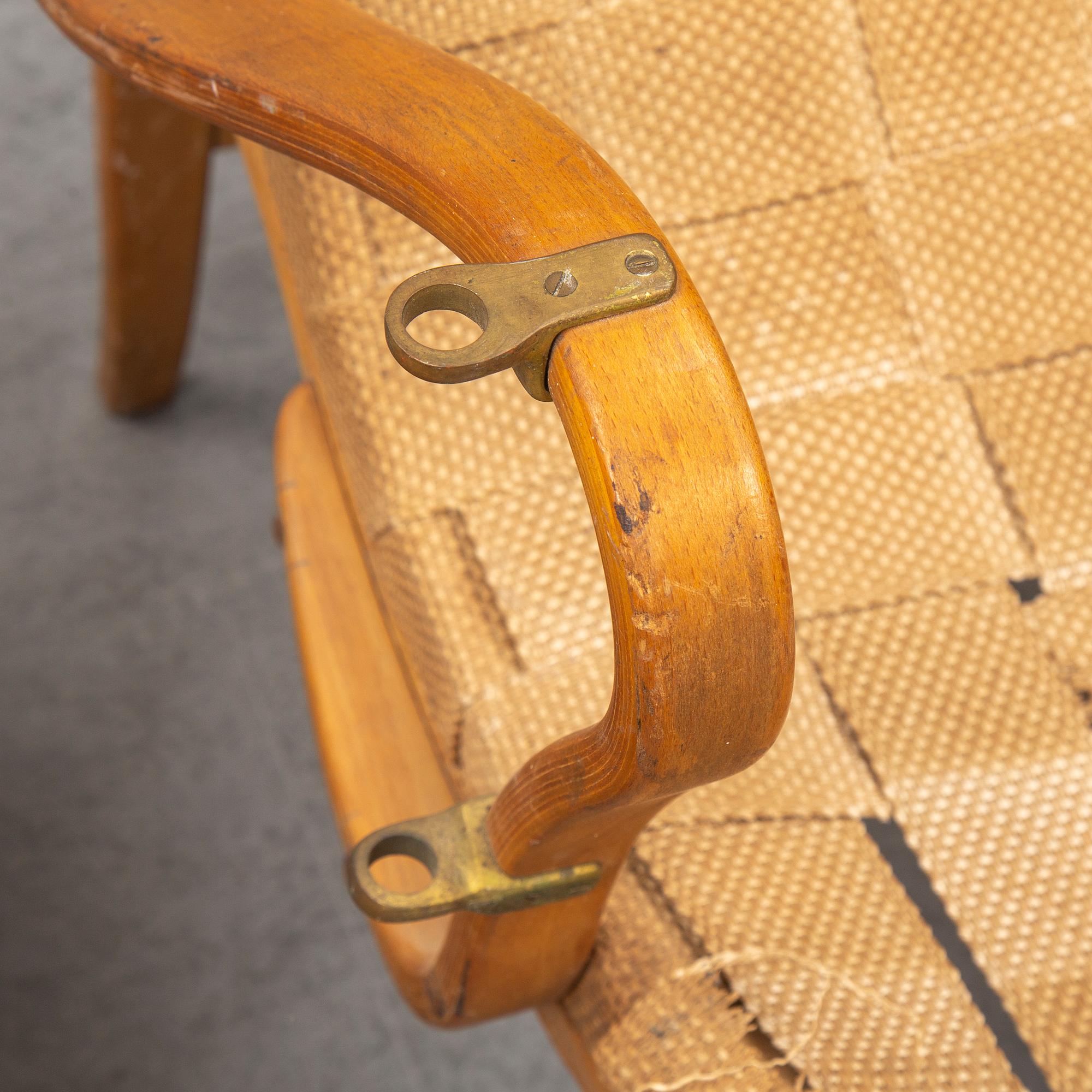 An mid 20th Century easy chair  and stool by Bruno Mathsson for Karl Mathsson Värnamo.