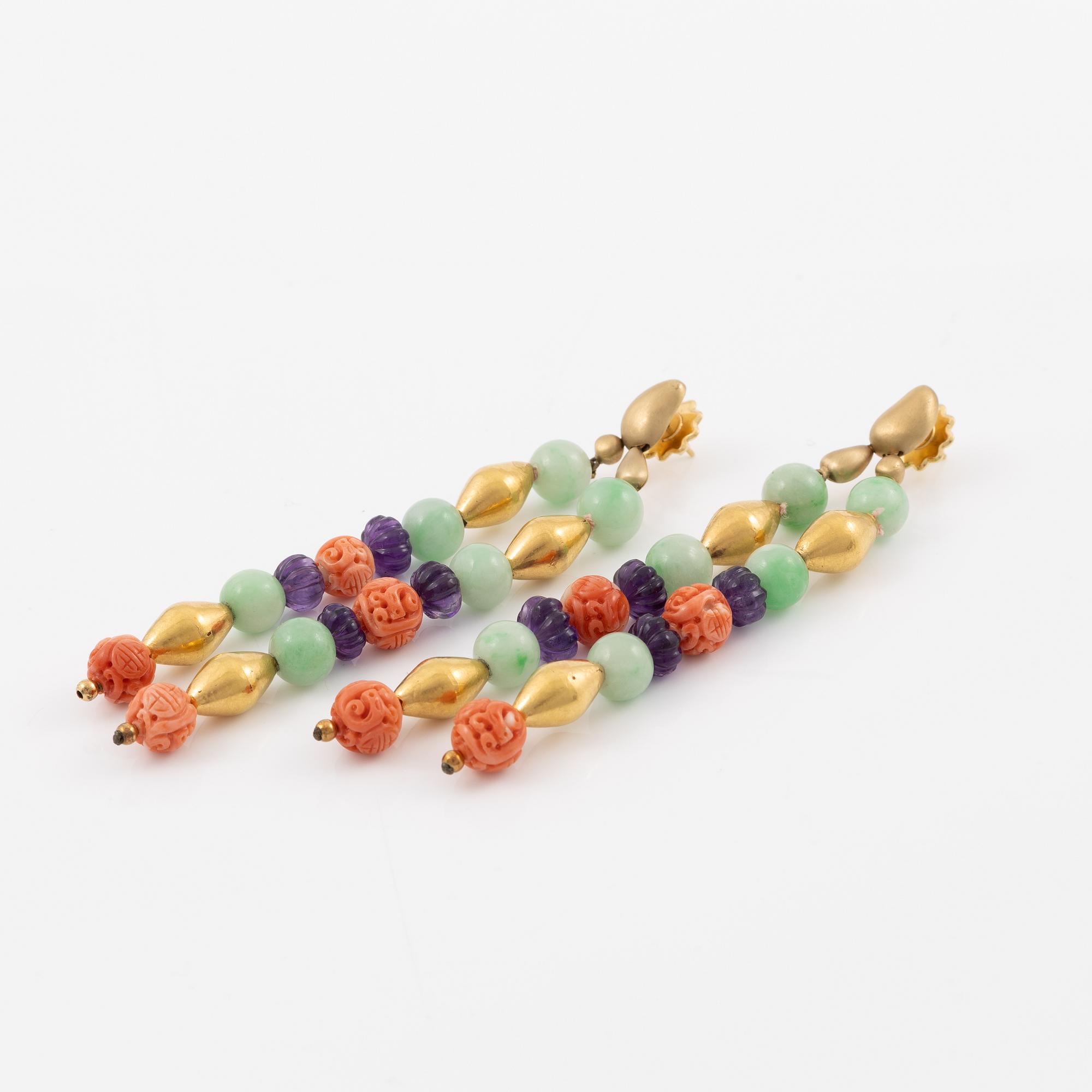 A pair of earrings in 18K gold with various coloured gemstones.