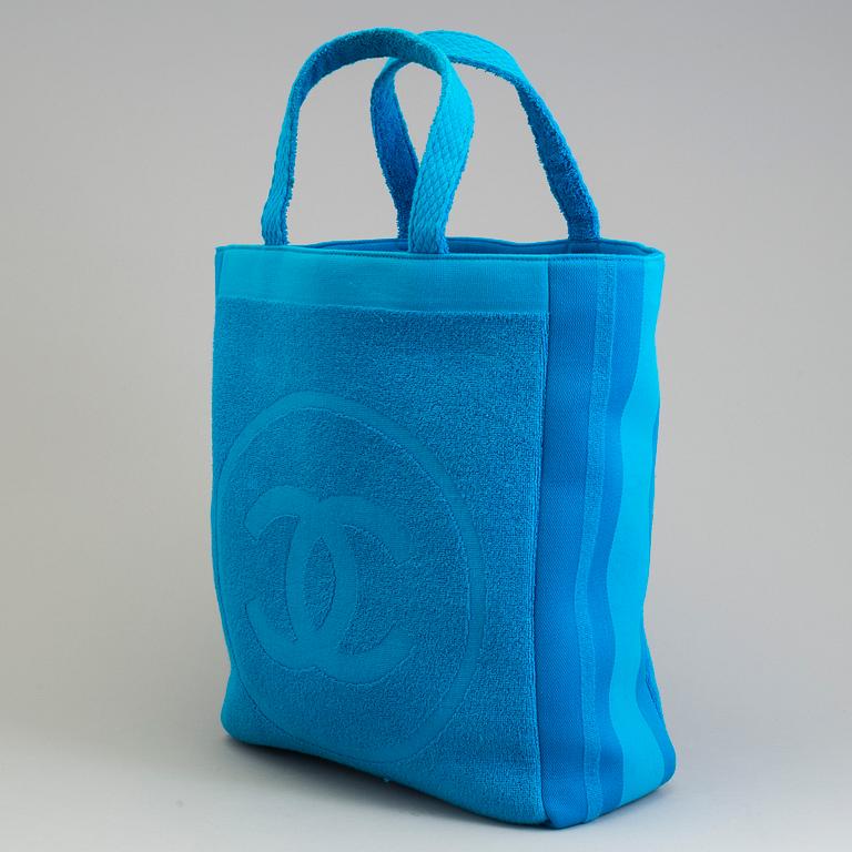 A Jumbo Bright Turquoise Blue "CC" Logo Cotton TERRY Cloth Beach Bag TOTE by Chanel and matching towel.