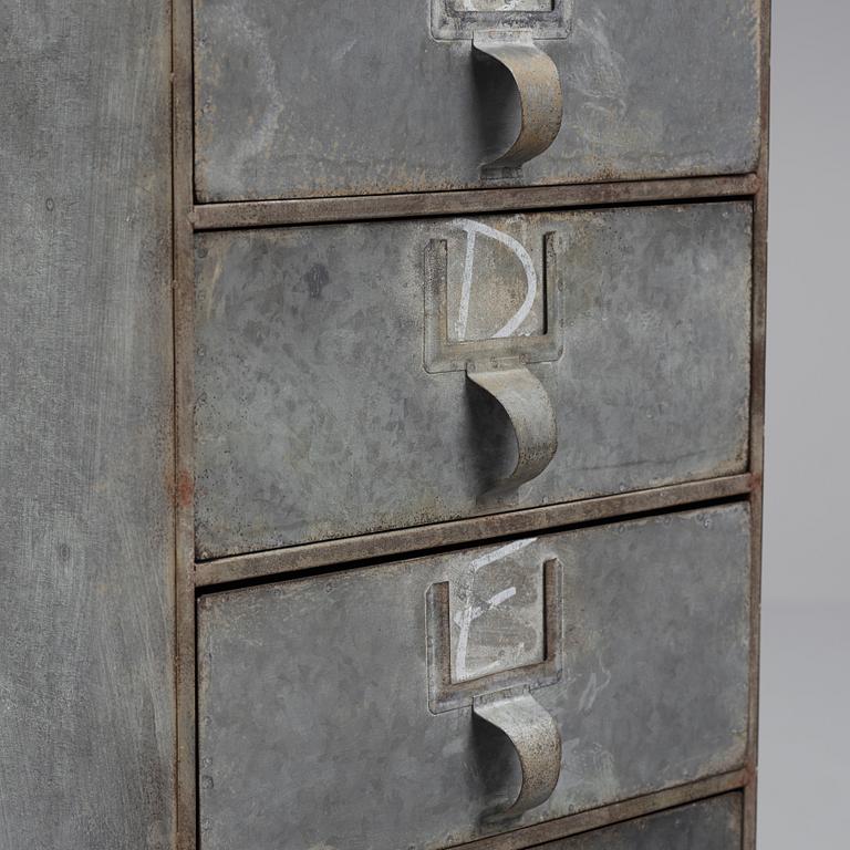A contemporary metal chest of drawers.