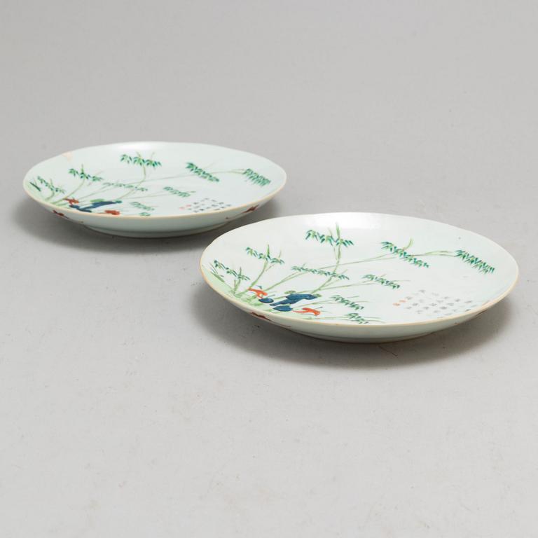 A pair of famille rose plates, late Qing dynasty.
