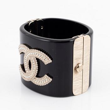 Chanel, a black acrylic cuff with pearls, 2019.