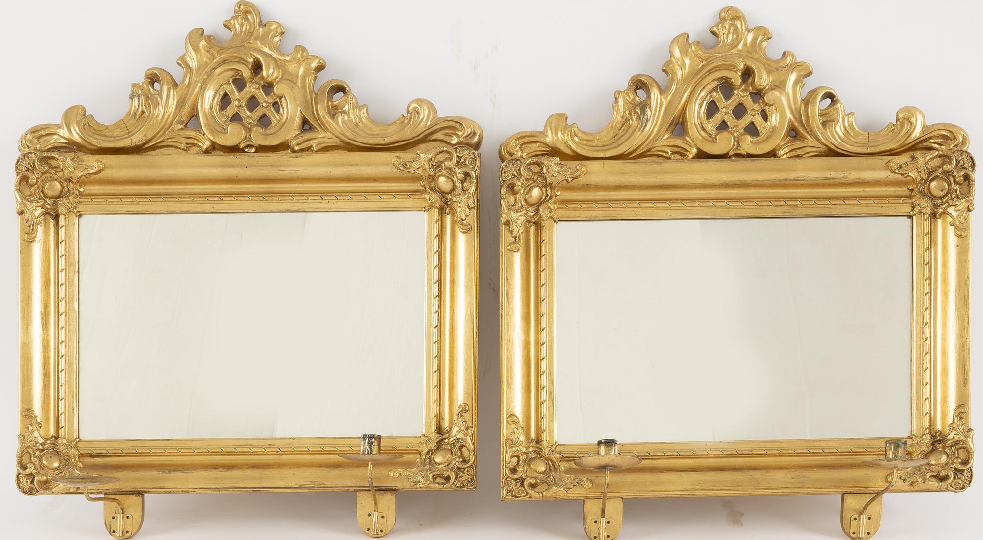 A pair of rococo-revival giltwood two-light girandoles, circa 1900.