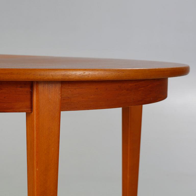 A dining table made in the middle of the 20th century.