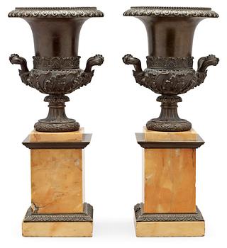 721. A pair of French mid 19th century patinated bronze and Siena marble tazza.