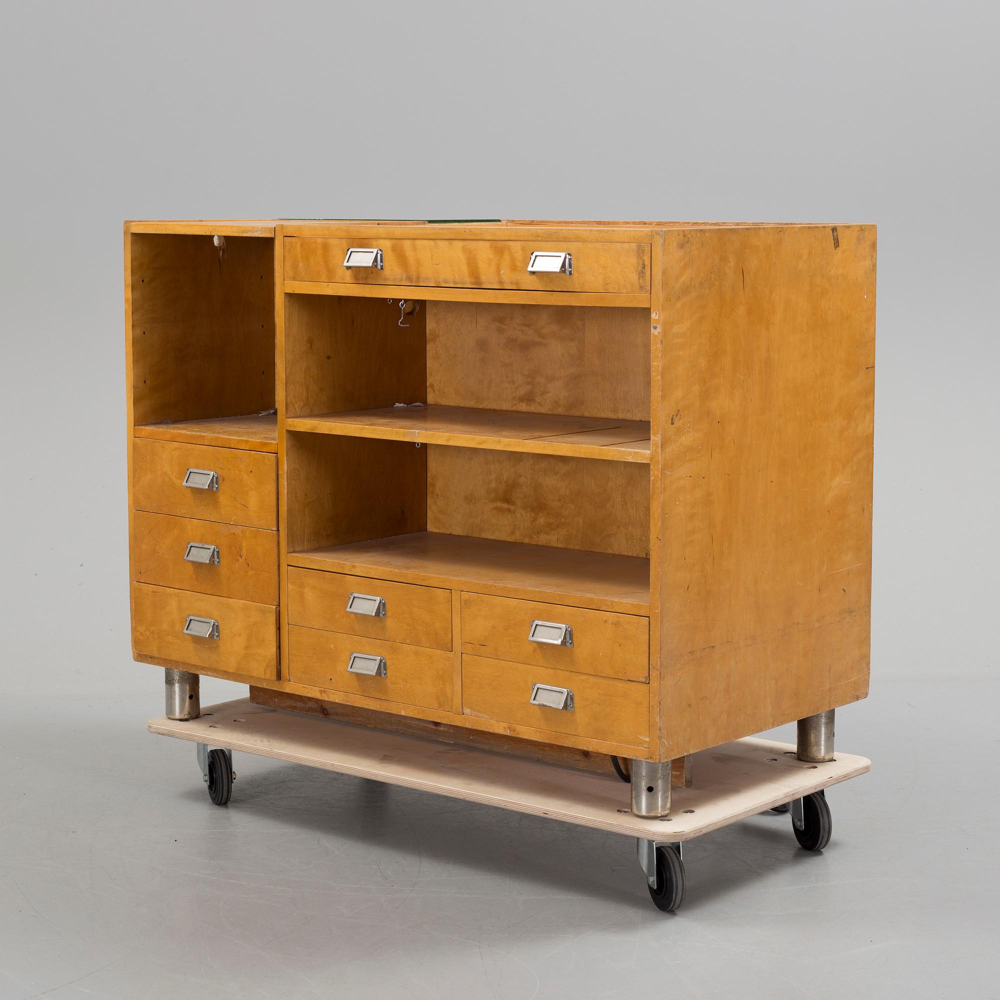 KÖPMANNADISK, 1900-talets mitt.