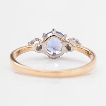 An 18K white gold ring, with a tanzanite and diamonds totalling approximately 0.04 ct.