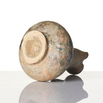 A turquoise-glazed Keshan jug, Persian, 13th century.