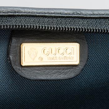 GUCCI, KLÄDÖVERDRAG SAMT VÄSKA, 1980-tal.
