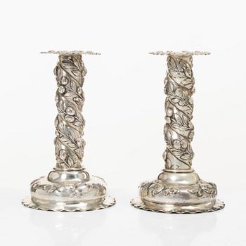 A pair of Baroque-style silver candle sticks, with Swedish import marks, first half of the 20th century.