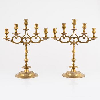 A pair of brass candelabras, early 20th century.