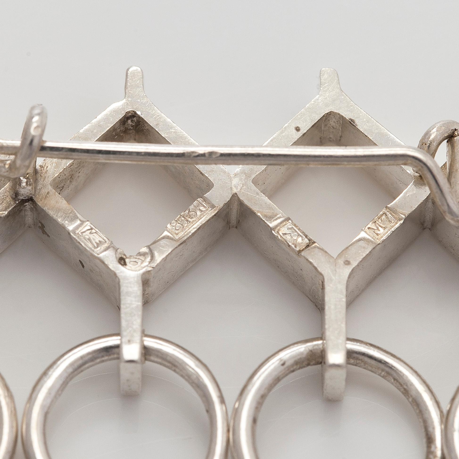 Jorma Laine, a set of two silver pendants, a bracelet and a brooch. Kultateollisuus Oy, Turku 1965-1972.