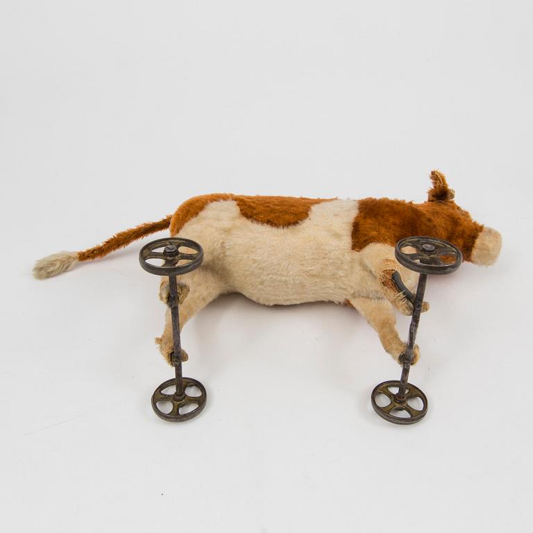 A Steiff cow and a Schuco "Tricky", Germany, 1910 and 1930/40s.