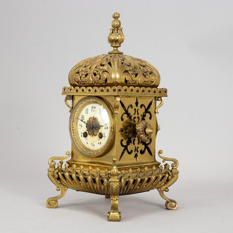 A brass mantle clock, early 20th century.