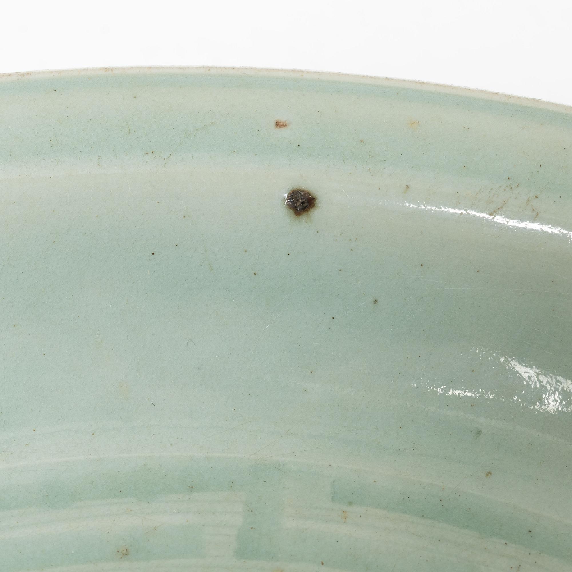A Chinese celadon dish, Ming dynasty (1368-1644).