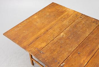 A drop-leaf table, 19th Century.