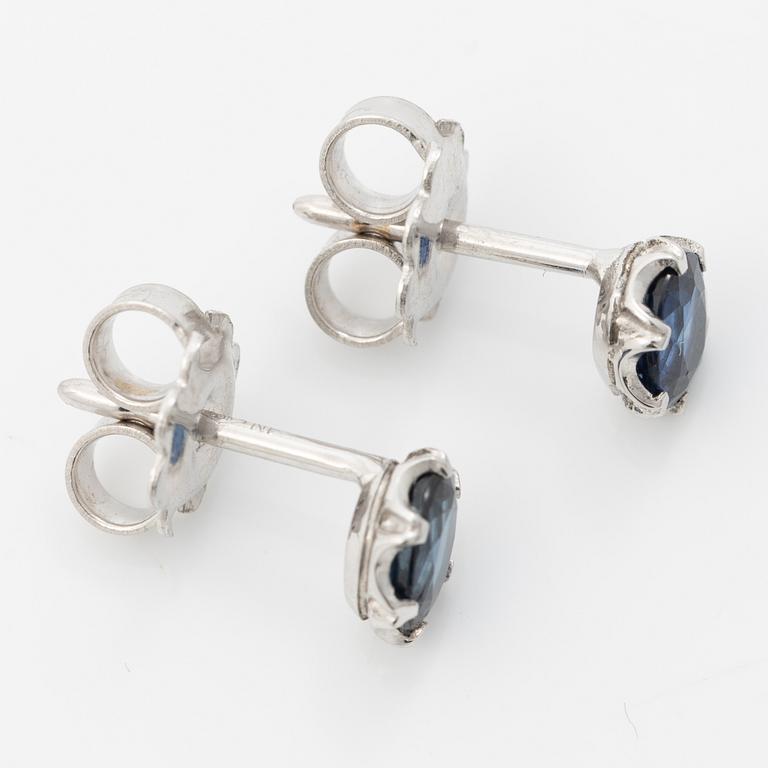 14K white gold earrings with faceted sapphires.