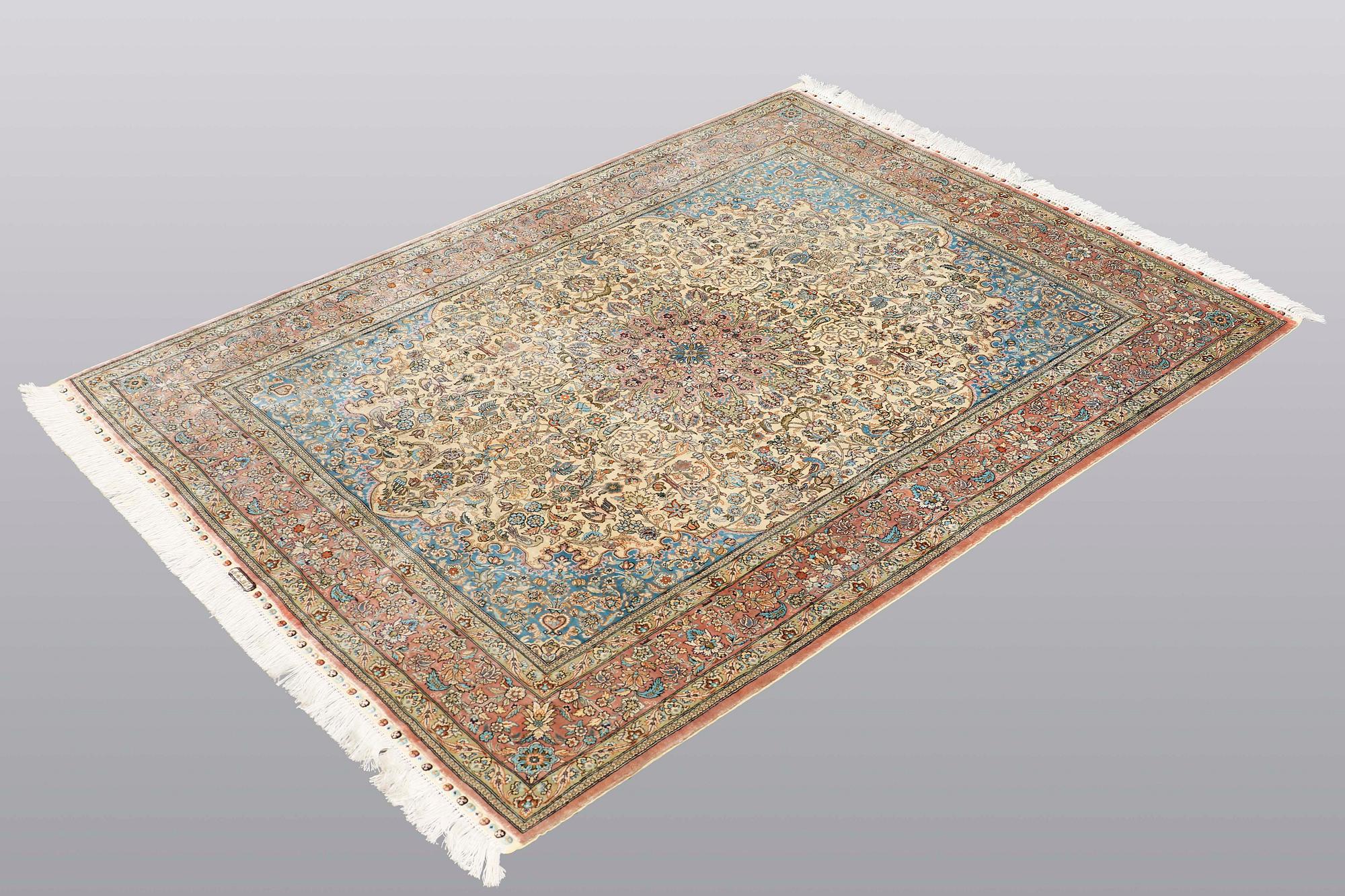 A rug, Figural Oriental silk,  signed, ca 175 x 125 cm.