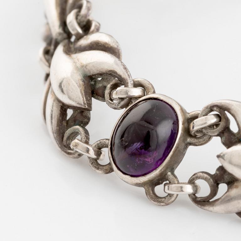 Georg Jensen, a silver bracelet set with cabochon-cut amethysts.