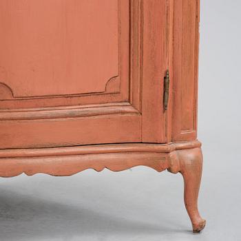 A rococo corner cabinet, later part 18th century.