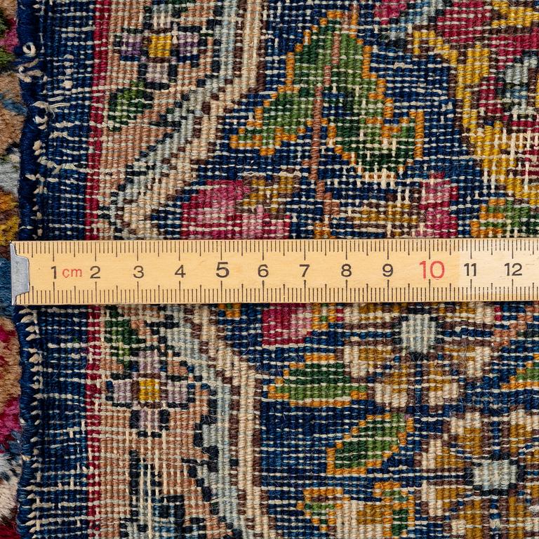 A semi-antique Kirman carpet, south Persia, c. 440 x 279 cm.