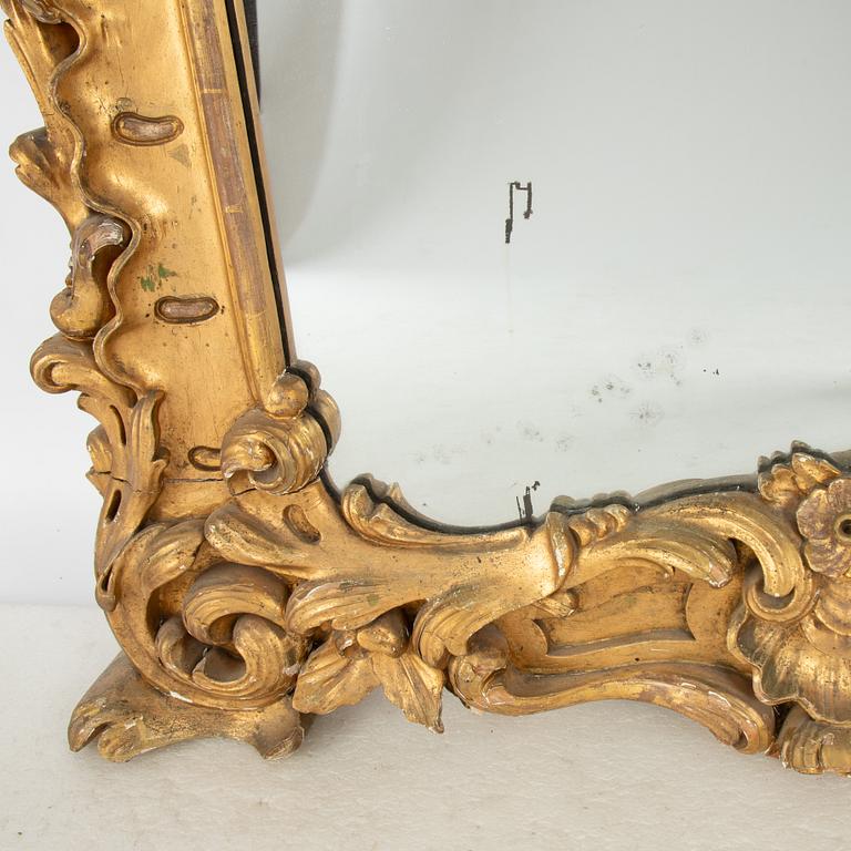 A large rococo-revival gilt-gesso mirror, later part 19th century.