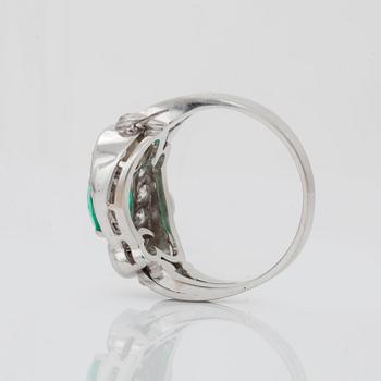 An emerald and brilliant-cut diamond ring. Total carat weight of diamonds circa 1.10 cts.