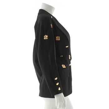 ESCADA, a black wool jacket with decor of gold colored numbers.