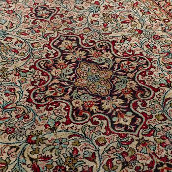 A silk Qum rug, around 114 x 80 cm.