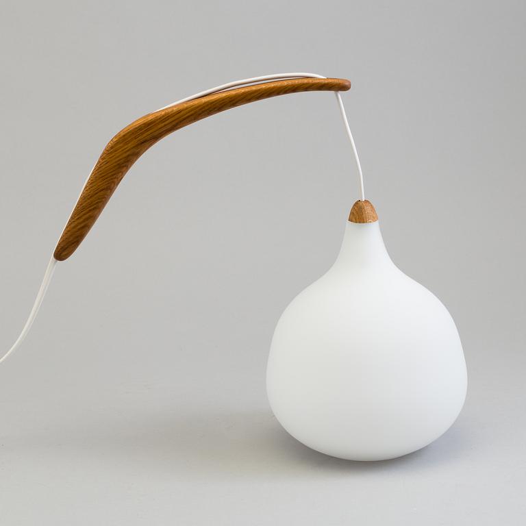 A Uno and Östen Kristiansson oak and glass wall lights from Luxus.