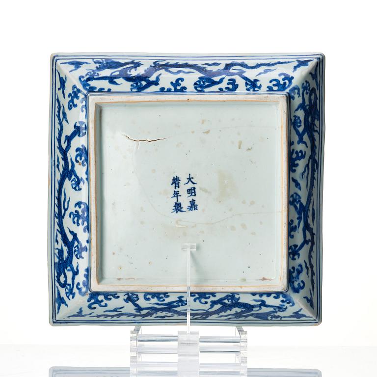 A blue and white dragon dish, Ming dynasty with Jiajings six character mark and of the period (1522-66).