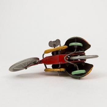 A tinplate Technofix bicycling clown Germany c. 1950.