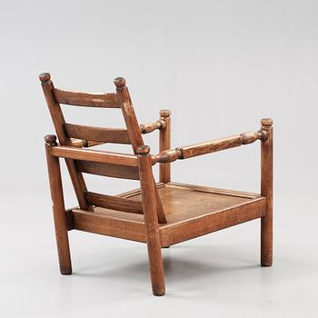 An Axel Einar Hjorth stained pine 'Sandhamn' armchair, Nordiska Kompaniet 1929.