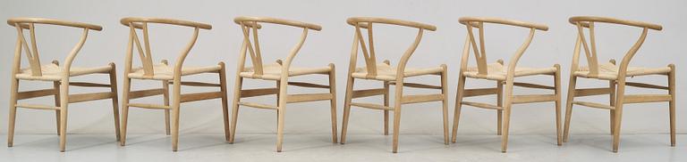 A set of six Hans J Wegner oak 'Wishbone chairs', Carl Hansen & Søn, Denmark.