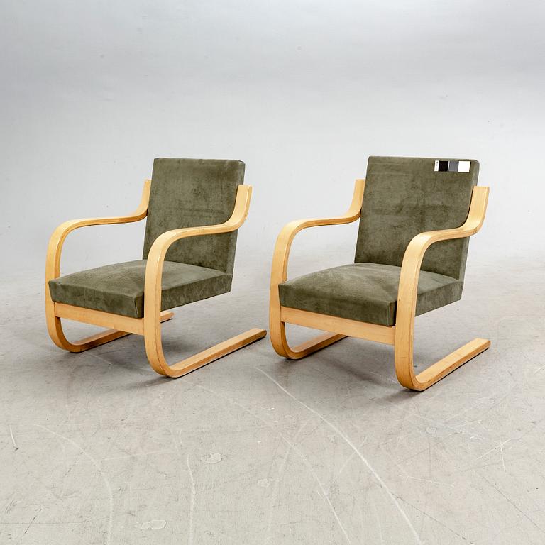 Alvar Aalto, a pair of birch armchairs model nr 402 21st century.