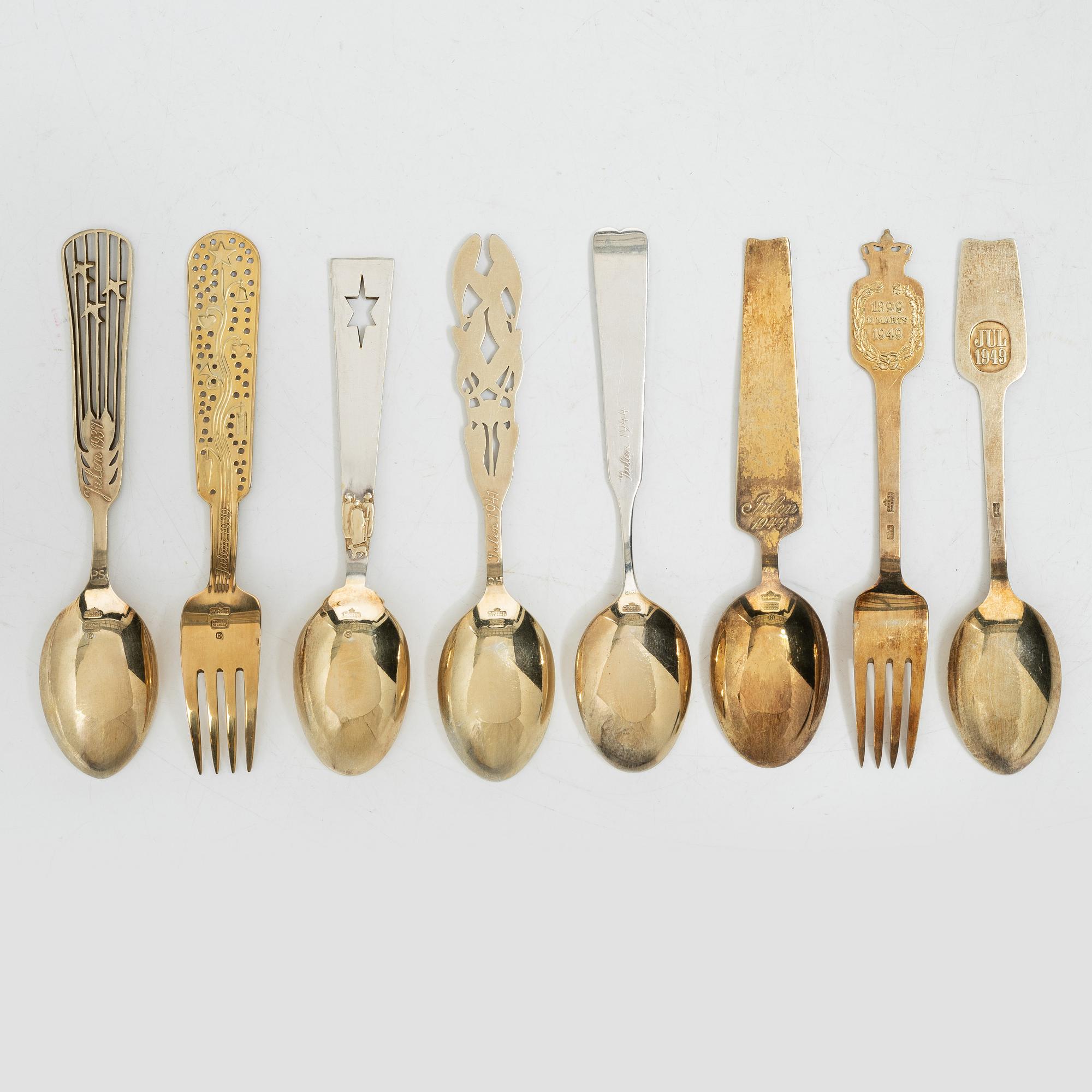 Anton Michelsen, Annual/Christmas cutlery, 8 pieces, gilt sterling silver and enamel, Denmark, 1930s–40s.