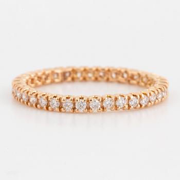 Brilliant-cut diamond eternity ring.