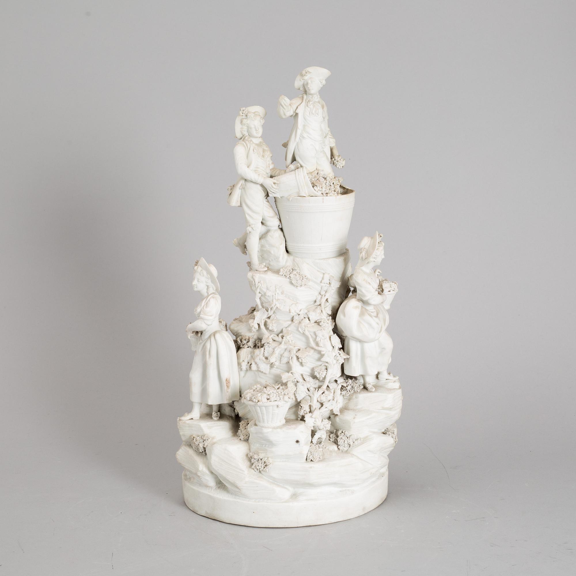 A biscuit porcelain figure group, circa 1900.