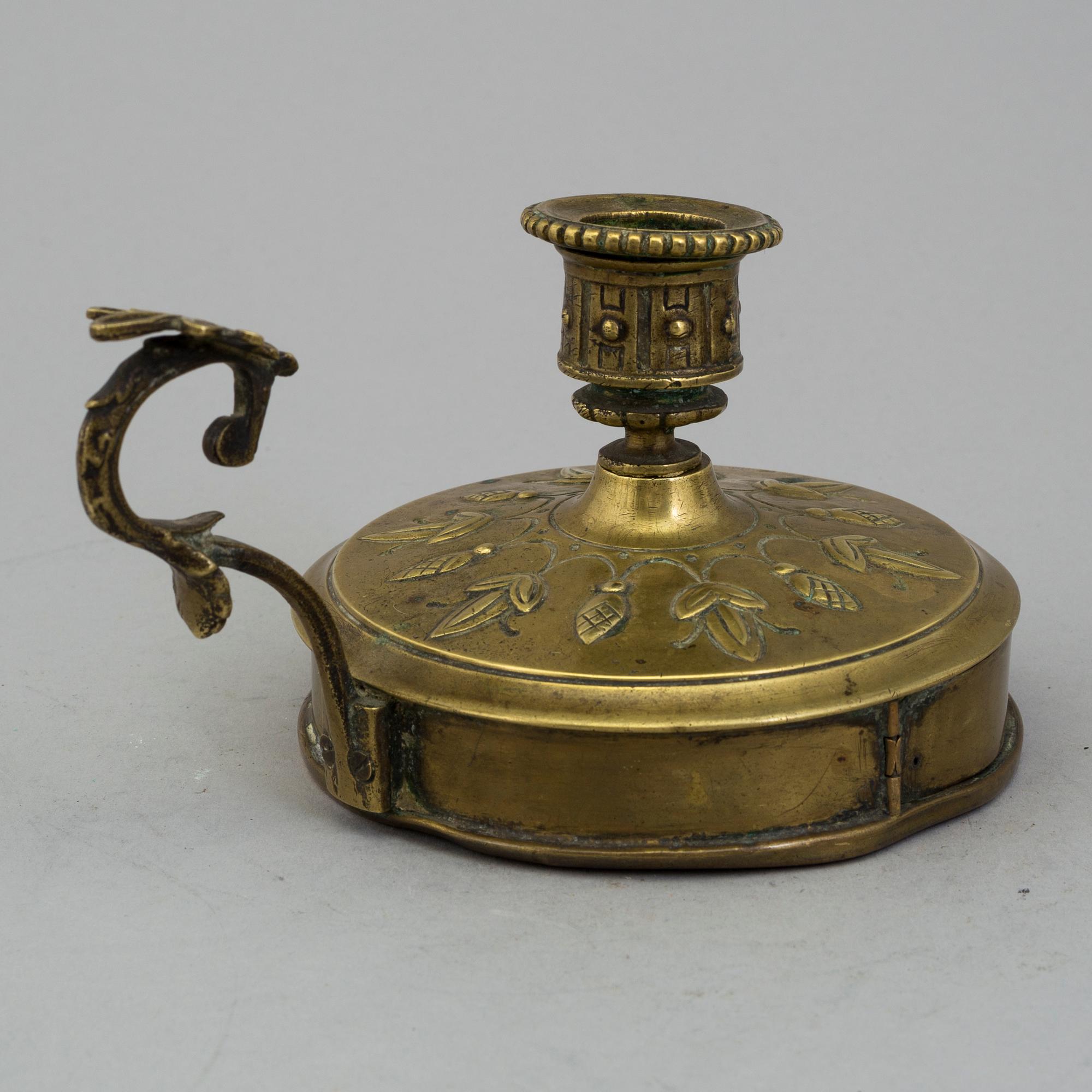 A BRASS NIGHT LIGHT HOLDER, first half of the 19th century.