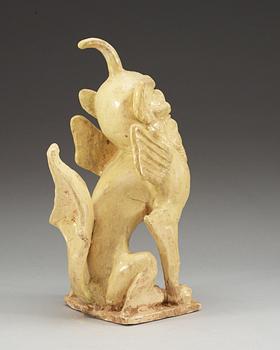 A yellow glazed pottery guardian, Tang dynasty (618-907).