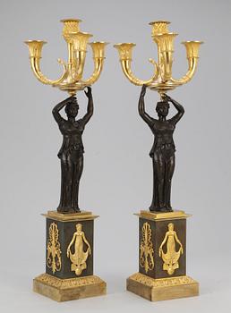 A pair of Empire four-light candelabra.