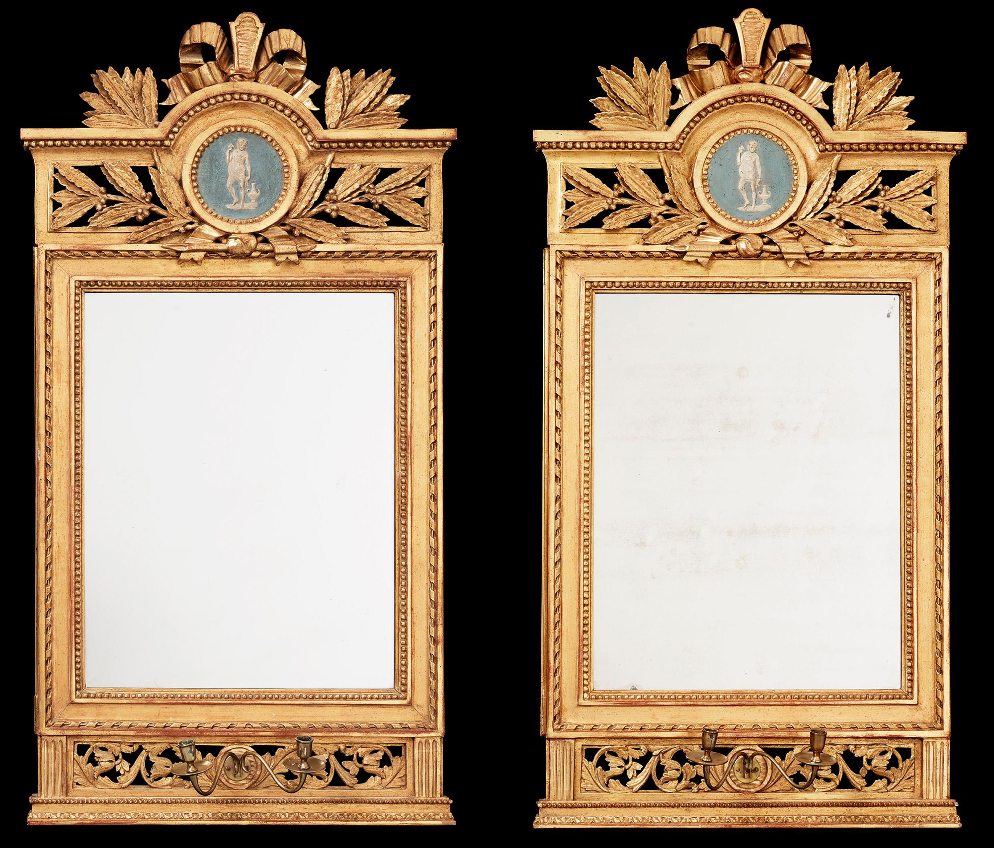 A pair of Gustavian two-light girandole mirrors by Lago Lundén, signed and dated 1789.