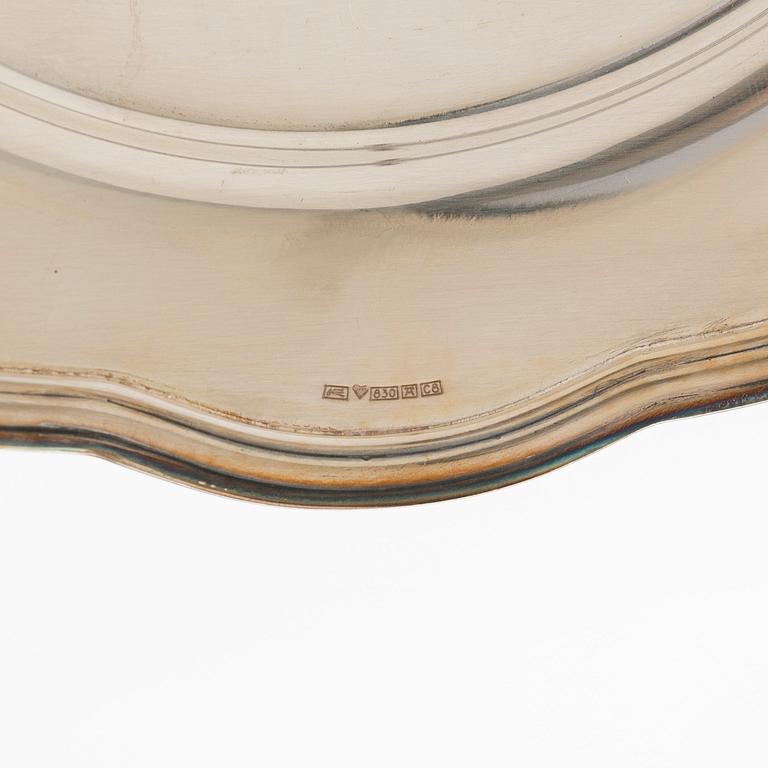 A 10-piece set of silver chargers, Kultateollisuus, Turku 1938 and 1980.